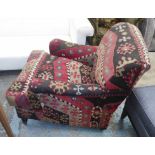 GEORGE SMITH ARMCHAIR, with kilim upholstery on short turned front supports with castors,