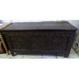 COFFER, James II oak with a rising lid, later sandalwood lining and carved triple panel front,