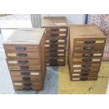 FILING DRAWERS, three mid 20th century metal bound pine units each having eight drawers,