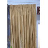 CURTAINS, a pair, gold silk, lined and interlined, each curtain 132cm W gathered x 287cm Drop.