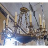 CHANDELIER, in the French Empire style, brass and patinated metal with twelve branches,