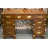 CAMPAIGN STYLE PEDESTAL DESK, 19th century and later walnut and brass bound with nine drawers,