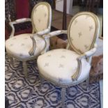 FAUTEUILS, a pair, George III style green painted and parcel gilt,
