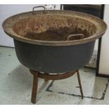 CAULDRON, cast iron on stand, 69cm H x 84cm D.