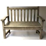 GARDEN BENCH, weathered teak of slatted construction and small proportions, 127cm W.