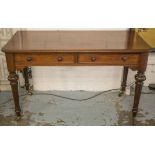 WRITING TABLE, Victorian mahogany with two drawers on fluted legs and castors,