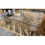 LOW TABLE, the glass top on four dog of fo supports, 130cm W x 130cm D x 42cm H.