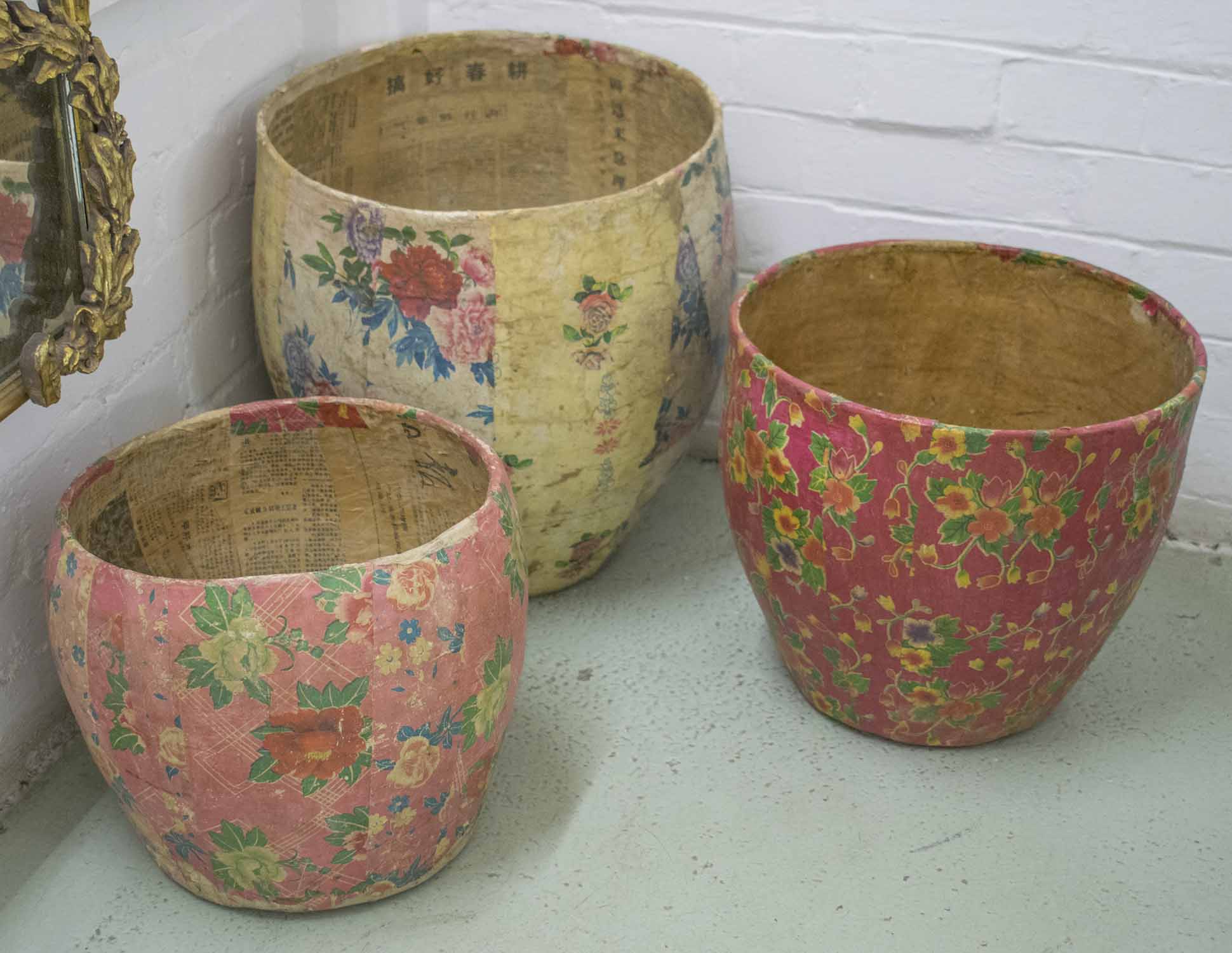PAPIER MACHÉ JARDINIERES, three similar Chinese of graduated sizes and floral design,