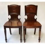 HALL CHAIRS, a pair, George IV mahogany with escutcheon recess panel seat and turned supports,