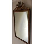 WALL MIRROR, early 20th century French carved walnut and parcel gilt,