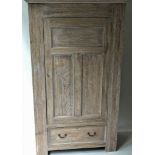 ARTS AND CRAFTS WARDROBE, early 20th century, limed oak with panelled door enclosing hanging space,