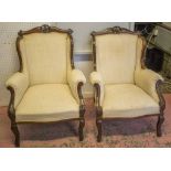 ARMCHAIRS, a companion pair, Edwardian mahogany in patterned cream fabric, 68cm W.