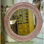 WALL MIRROR, Indian pink painted with circular carved pendant frame, 120cm D.