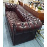 CHESTERFIELD SOFA, with buttoned red wine coloured upholstery, 266cm L x 74cm H.