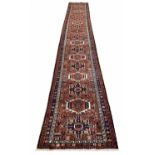 FINE PERSIAN KARAJA LONG RUNNER, 570cm x 85cm.