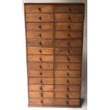 BANK OF DRAWERS, 19th century Irish oak with twenty six drawers, 129cm H x 65cm x 27cm.