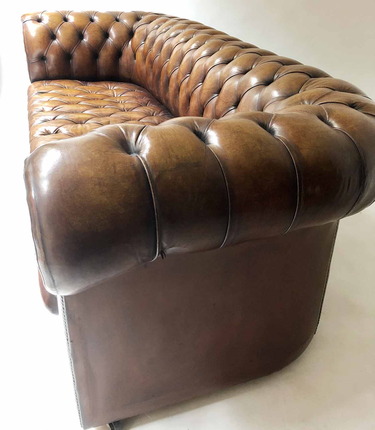 CHESTERFIELD SOFA, early 20th century buttoned tan leather, 210cm W. - Image 4 of 4