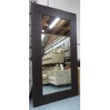 WALL MIRROR, of substantial proportions, contemporary woven leather frame, 122cm x 222cm.