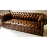 CHESTERFIELD SOFA, early 20th century buttoned tan leather, 210cm W.