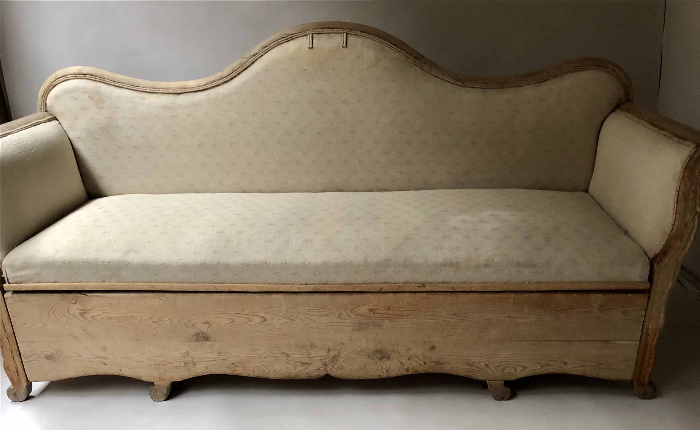 SWEDISH DAY BED, 19th century Swedish pine and linen upholstered with pull out seat and scroll arms,