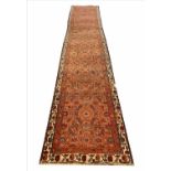 ANTIQUE FEREGHAN RUNNER, 485cm x 92cm, all over herati design.