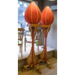 FLOOR LAMPS, a pair, Chinese red lacquer and gilt with ovoid silk shades, 215cm H x 63cm.