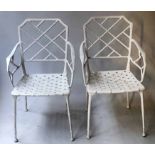 FAUX BAMBOO ARMCHAIRS, a pair, white painted cast aluminium patented.