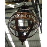 HALL LANTERN, spherical, in a bronzed finish with curved glass, 67cm H.