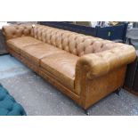 CHESTERFIELD SOFA, of very large proportions, buttoned brown leather, 300cm L x 95cm D x 82cm H.