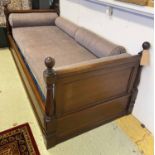 DAYBED, 19th century mahogany with mattress, bolster cushions, turned columns and finials,