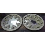 WALL MIRRORS, a pair, Gothic revival style composite stone surrounds, 44cm diam.