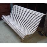 GARDEN BENCH, with a curved back, wooden slats and white painted iron ends, 167cm L x 83cm H.