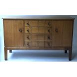 GORDON RUSSELL SIDEBOARD, mid 20th century, oak, with four drawers flanked by cupboard doors,
