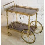 DRINKS TROLLEY, brass and mahogany of two galleried tiers, 71cm H x 51cm x 77cm.