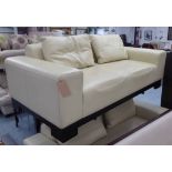 SOFA, cream leather contemporary style, 98cm x 70cm H x 202cm.