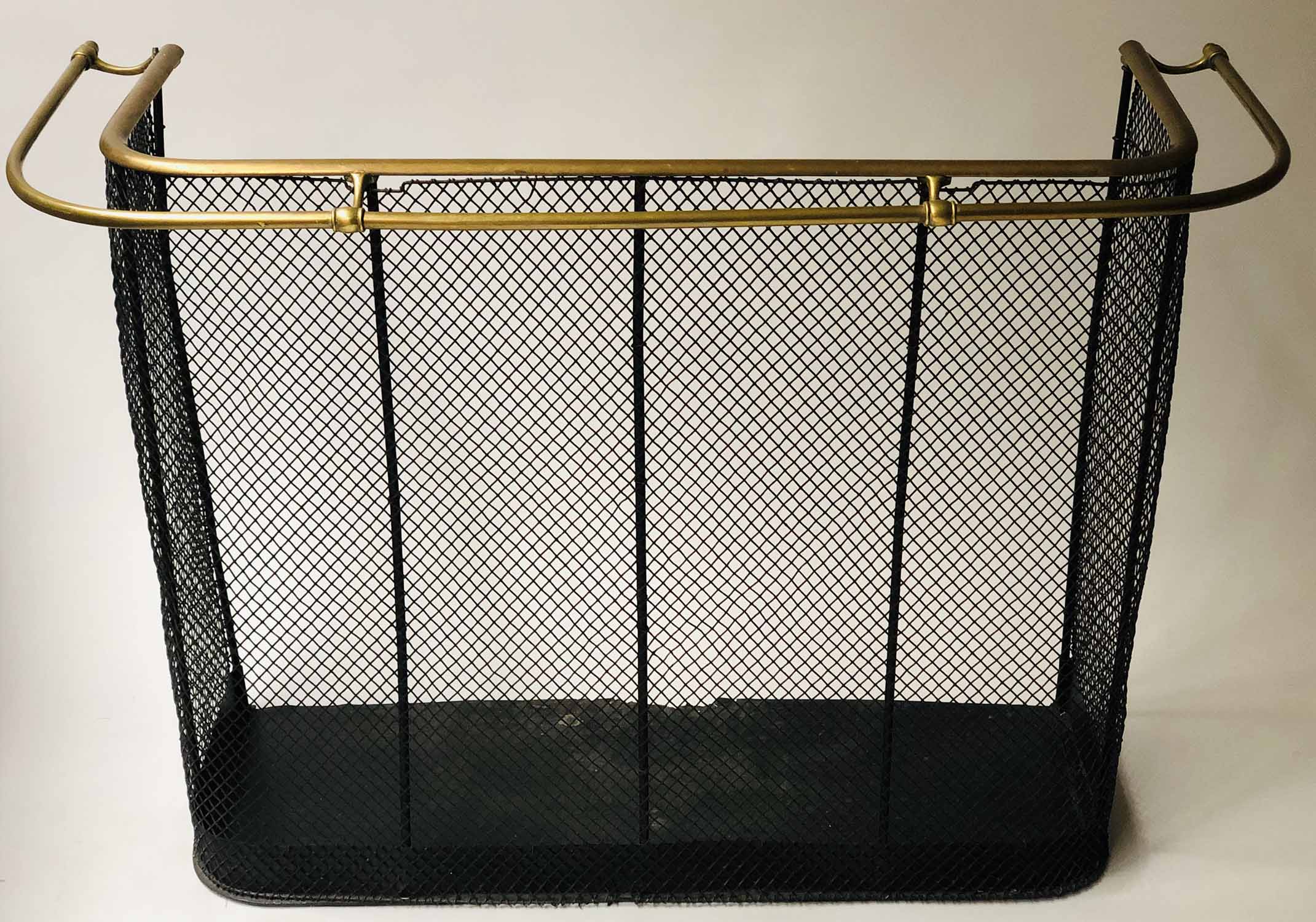 NURSERY FENDER, Victorian iron framed black painted mesh panels with dual brass top rails,