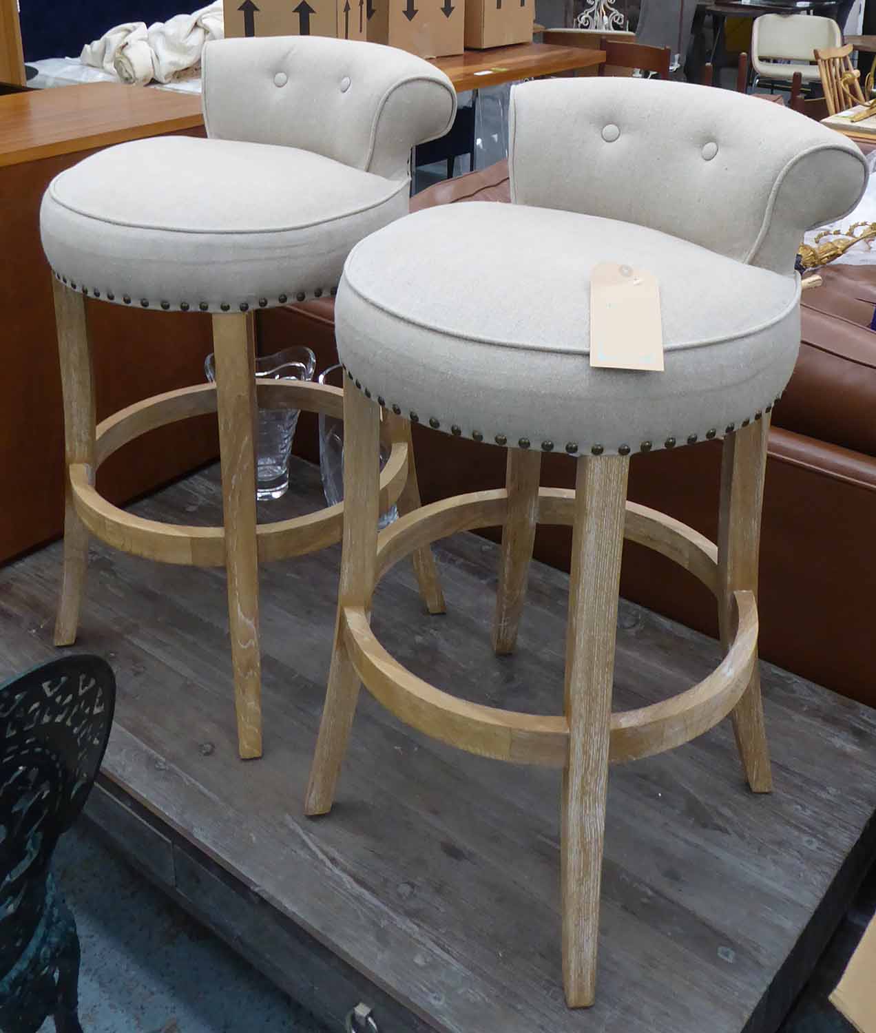 BAR STOOLS, a pair, in the contemporary country house style, buttoned back finish.