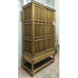 CABINET, 20th century Chinese firwood with two grille doors above two short drawers,