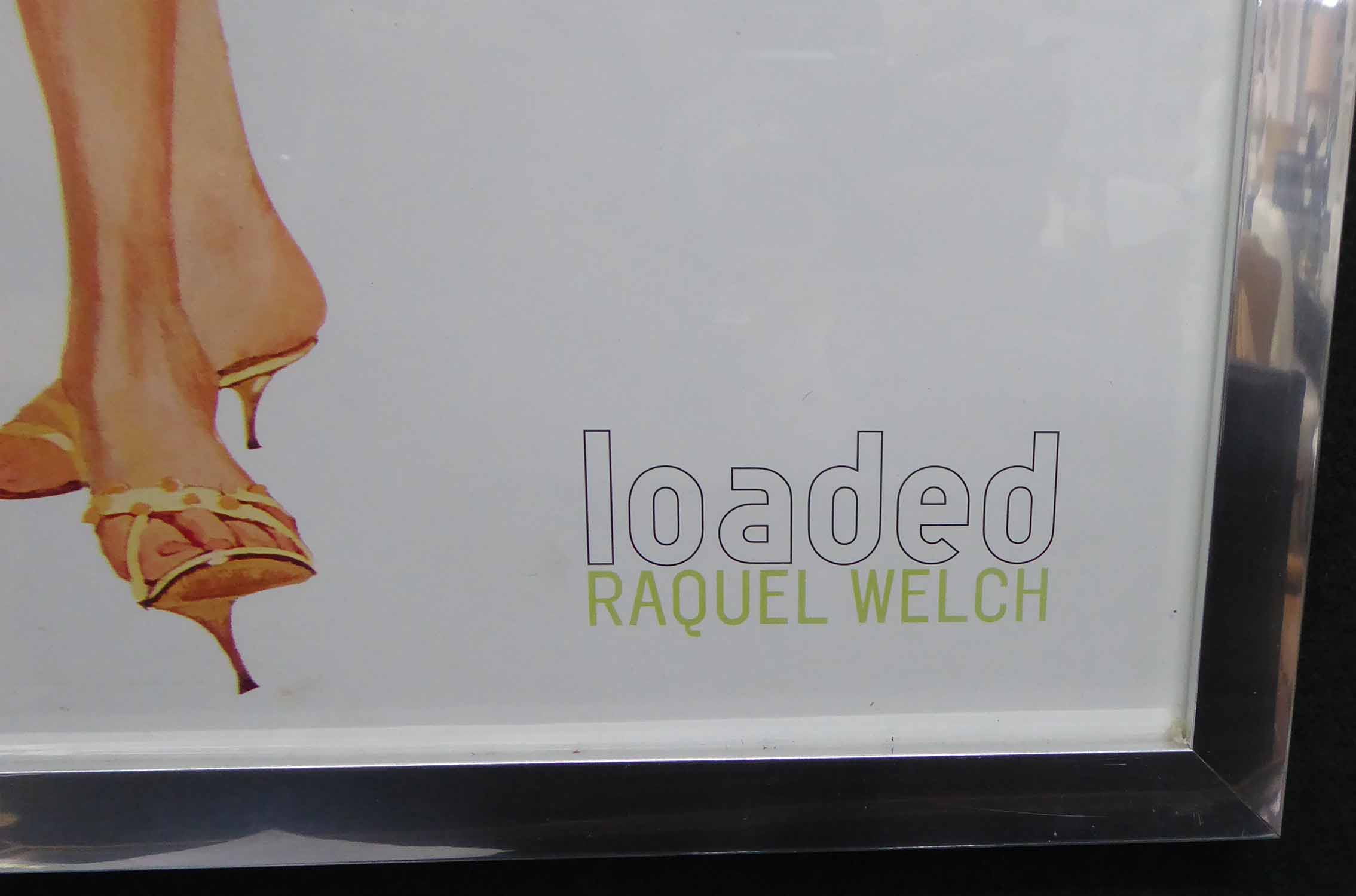 LOADED MAGAZINE RACQUEL WELCH POSTER, after Roland Corant, framed and glazed, 63.5cm x 31.5cm. - Image 2 of 4