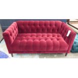 SOFA, of slight proportions, burgundy red upholstery, buttoned back finish, 150cm W.