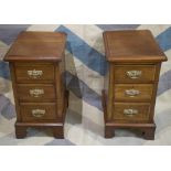 BEDSIDE CHESTS, a pair, part Victorian walnut, each containing three drawers, adapted,
