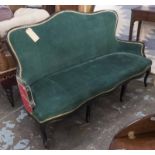 CANAPE, with an ebonised showframe, green velvet seat and contrasting palm patterned fabric to back,