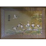 JAPANESE SCHOOL 'Cranes on Pine Tree Branches', silk embroidery, 70cm x 97cm, framed and glazed.
