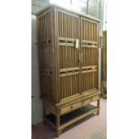 CABINET, 20th century Chinese firwood with two grille doors above two short drawers,