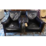 CLUB ARMCHAIRS, a pair, black leather with studs, 70cm x 78cm H.
