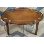 BUTLERS TRAY TABLE, Georgian style mahogany of oval form with hinged handles,