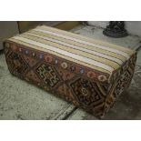 STOOL, kilim covered of rectangular form, 43cm H x 126cm W x 59cm D.