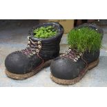 GARDEN PLANTERS, a pair, painted stone in the form of walking boots, 35cm H x 35cm x 74cm.