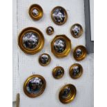 CONVEX WALL MIRRORS, a set of 12, of various sizes and descriptions, Regency manner.