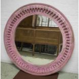 WALL MIRROR, Indian pink painted with circular carved pendant frame, 120cm diam.